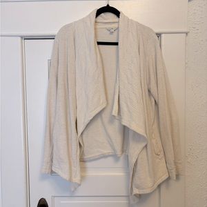 Lucky Lotus cream colored cardigan with crochet detailing and pockets.